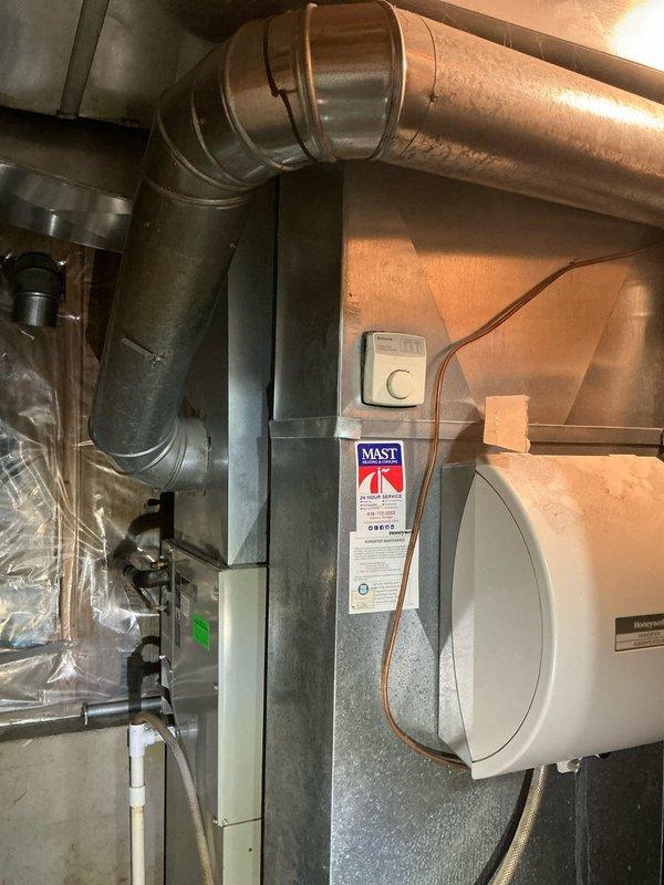 Conducted equipment assessment and provided estimate for complete HVAC system replacement at single-family residential property. Evaluated existing 24-25 year old furnace and air conditioning system located in basement utility area. Documented current equipment configuration including furnace with copper refrigerant lines, PVC condensate drain system, existing ductwork, and associated HVAC components. Photographed equipment specifications, manufacturer labels, and installation layout to provide accurate replacement recommendations. No active system failures reported; assessment performed at homeowner's request for equipment upgrade planning purposes.
