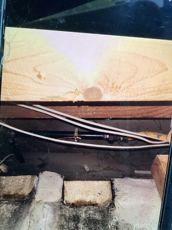 Responded to failed CSST bonding inspection and corrected the bonding method to comply with MRC Section G2411 (310.1.1) requirements. Installed proper bonding connection on the corrugated stainless steel tubing gas line system in the crawl space area, ensuring the bonding clamp and conductor meet code specifications for electrical continuity and grounding protection. Documented corrected installation with photos showing compliant bonding hardware on copper piping assembly and CSST routing through floor joists, ready for re-inspection approval.