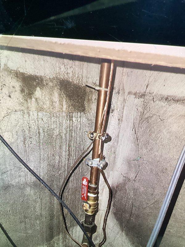 Responded to failed CSST bonding inspection and corrected the bonding method to comply with MRC Section G2411 (310.1.1) requirements. Installed proper bonding connection on the corrugated stainless steel tubing gas line system in the crawl space area, ensuring the bonding clamp and conductor meet code specifications for electrical continuity and grounding protection. Documented corrected installation with photos showing compliant bonding hardware on copper piping assembly and CSST routing through floor joists, ready for re-inspection approval.