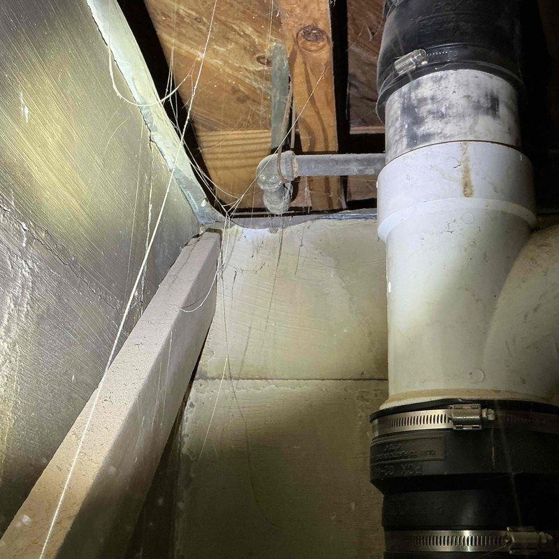 Returned for follow-up service to address sink fitting issue from previous visit. Inspected plumbing connections under sink where fittings had detached after initial repair attempt. Provided hands-on instruction to client on proper installation technique for sink fittings to ensure secure connection. Documented existing plumbing configuration including galvanized steel pipe assemblies, flexible supply lines, and PVC drainage connections in crawl space area.