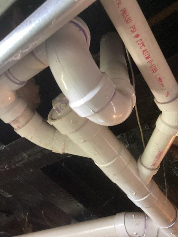 Responded to service call for non-functional Morton water softener system. Upon arrival, inspected the complete water treatment installation including pre-filtration system with blue canister housing and associated piping configuration. Evaluated the water softener unit, plumbing connections, bypass valve assembly, and drain line routing. Identified issue with system operation and performed necessary adjustments to restore proper functionality. Verified water flow through filtration system and softener unit, confirmed proper drain line installation and trap assembly, and tested system cycling. Unit returned to normal operating condition with all components functioning as designed.