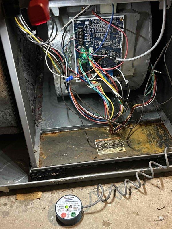# CP-Cooling Problem

Responded to tenant complaints of intermittent heating and cooling operation on 9-year-old HVAC system experiencing random shutdowns. Upon inspection, accessed main unit cabinet and examined control board, relay assembly, and electrical connections. Found significant dust accumulation throughout interior components and on circuit board connections, which can cause intermittent operation due to poor electrical contact and overheating protection triggers. Photographed control board wiring configuration and internal component layout for documentation. Removed and inspected capacitor assembly, which showed signs of age-related wear. Cleaned control board area, verified wire connections at relay points, and tested electrical continuity of primary circuits. System components including capacitor were evaluated for proper operation. Addressed dust buildup on metal housing surfaces and base plate area that could contribute to thermal cycling issues. Equipment was restored 