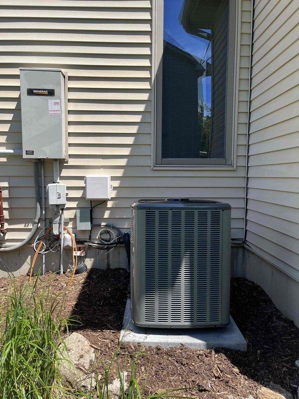 Completed full HVAC system installation including new furnace and air conditioning unit at residential property. Installed outdoor condensing unit on concrete pad with proper clearances, connected refrigerant lines and electrical conduit to existing Generac transfer switch panel. Interior installation included new furnace with supply and return ductwork in basement mechanical room, utilizing metal trunk lines and transitions. All equipment properly mounted, leveled, and secured per manufacturer specifications. System startup performed, refrigerant charge verified, and all electrical connections tested for proper operation.