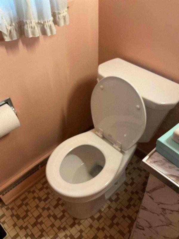 Responded to emergency toilet repair at residence where the only toilet had failed, requiring the homeowner to shut off the main water supply due to the absence of a dedicated fixture shut-off valve. Upon arrival, assessed the toilet malfunction in the compact bathroom with mosaic tile flooring and peach walls. Completed necessary repairs to restore the toilet to proper working condition, eliminating the need for the main water shutoff and restoring full water service to the home.