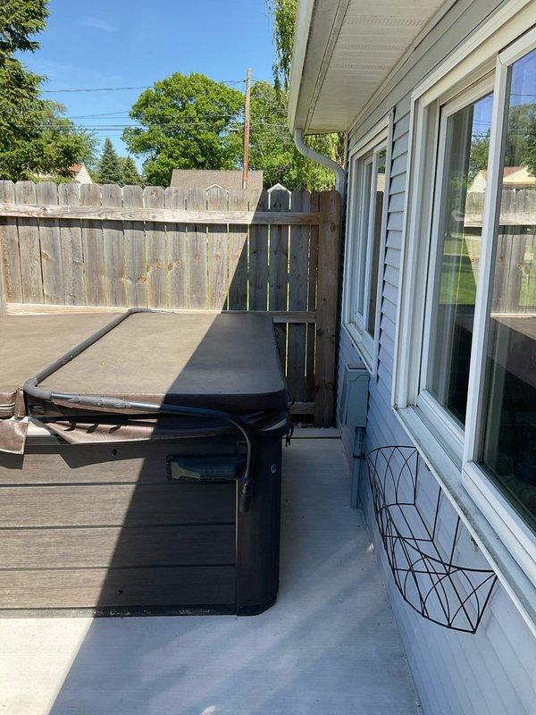 Completed electrical hookup and connection for residential hot tub installation on exterior deck. Verified proper power supply, tested all electrical connections for safety and functionality, and ensured spa equipment was operational and ready for use.