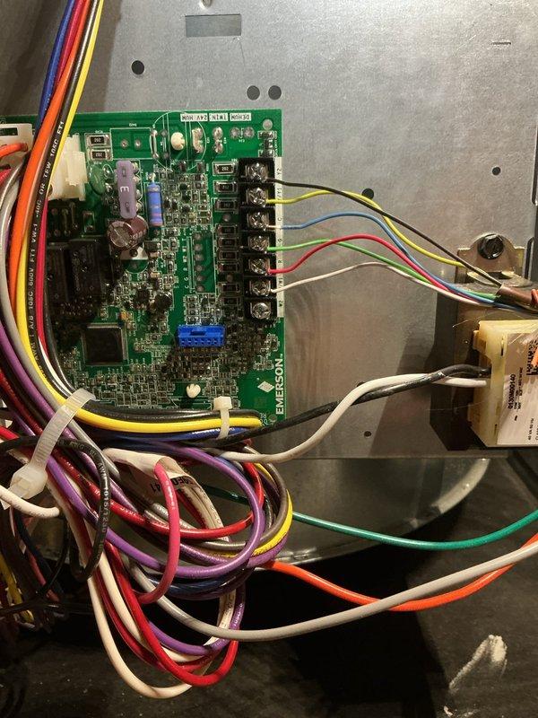 Responded to service call for furnace blower fan that would not shut off. Upon arrival, accessed the HVAC unit and inspected the control board and associated wiring connections. Examined the integrated circuit board mounted in the control panel, checking all terminal connections and wire harness integrity. Verified proper connections at the terminal blocks where multiple control wires (thermostat wiring, fan control, and power connections) interface with the main PCB. Inspected the relay components and capacitors on the control board for signs of failure or damage. Tested the control board functionality and confirmed the fan relay was remaining energized due to a faulty circuit board. Replaced the defective control board with new unit, reconnected all wiring to proper terminals following manufacturer specifications, and secured the board in the control panel. Restored power to the system and cycled the thermostat through multiple heating calls to verify proper fan operation. Confirmed 