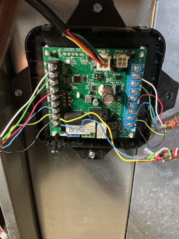 Responded to service call for furnace blower fan that would not shut off. Upon arrival, accessed the HVAC unit and inspected the control board and associated wiring connections. Examined the integrated circuit board mounted in the control panel, checking all terminal connections and wire harness integrity. Verified proper connections at the terminal blocks where multiple control wires (thermostat wiring, fan control, and power connections) interface with the main PCB. Inspected the relay components and capacitors on the control board for signs of failure or damage. Tested the control board functionality and confirmed the fan relay was remaining energized due to a faulty circuit board. Replaced the defective control board with new unit, reconnected all wiring to proper terminals following manufacturer specifications, and secured the board in the control panel. Restored power to the system and cycled the thermostat through multiple heating calls to verify proper fan operation. Confirmed 