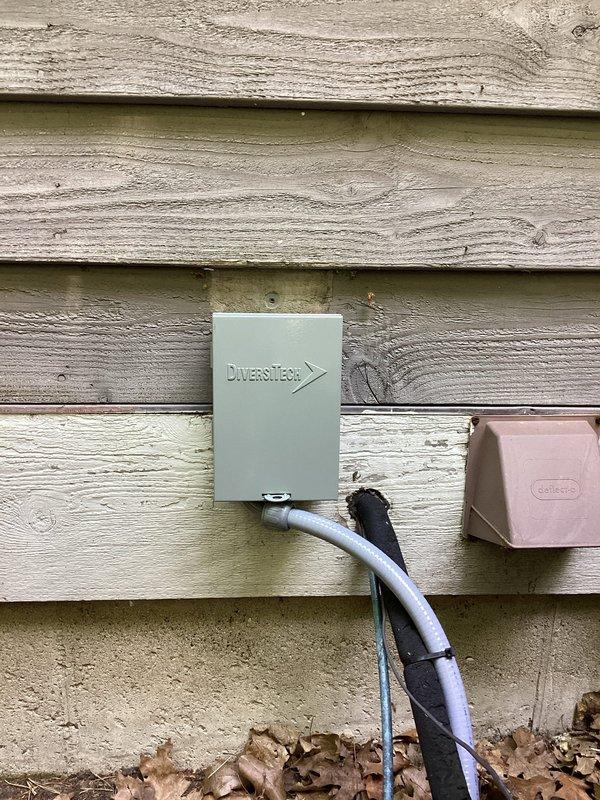 Responded to no cooling call on 20-year-old Comfortmaker R22 system with history of rodent damage from previous season that had caused grounded 24V wiring and corroded dual capacitor and contactor. Upon arrival, accessed condenser unit and documented extensive interior corrosion and rust throughout cabinet from prolonged moisture exposure. Inspected electrical connections and wiring harness at contactor and terminal block, noting deteriorated condition of components. Photographed damaged areas showing rust accumulation at base of unit and around connection points, as well as exterior disconnect and utility boxes. Homeowner authorized remotely via phone after reviewing documented conditions. Due to age of equipment, R22 refrigerant type, extent of previous rodent damage, and current corrosion issues, recommended system replacement as most cost-effective solution versus ongoing repairs.
