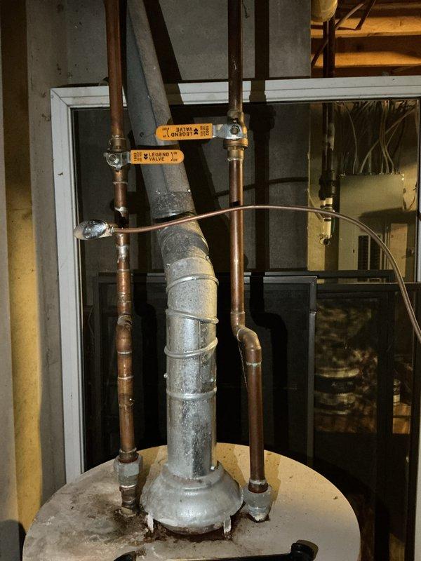 Performed comprehensive assessment of 16-year-old Bradford White residential water heater for replacement estimate. Documented existing unit specifications, plumbing connections, and installation configuration including copper supply lines, valves, and top-mounted connections. Confirmed standard residential installation location and verified best contact information for follow-up coordination.