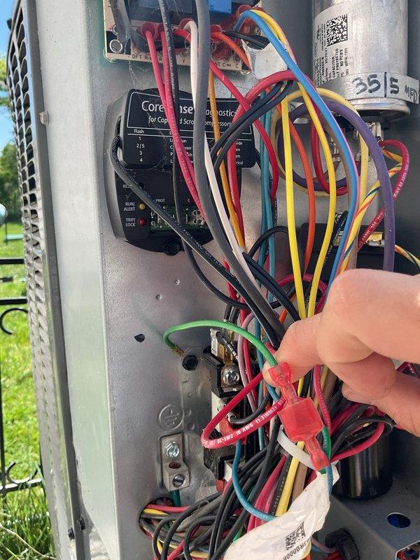 # NC-No Cool Service Completed

Responded to no cooling complaint on 2-year-old EnergiAir system. Upon arrival, performed diagnostic testing using refrigerant manifold gauges and digital multimeter to assess system operation. Inspection revealed electrical control issues requiring attention to wiring connections at the condensing unit. Accessed electrical panel and examined CoreSense control board, contactor assembly, and dual-run capacitor (38/5 MFD). Verified proper wire terminations and electrical connections throughout the control circuit. Tested refrigerant pressures on both high and low sides of the system using professional-grade manifold gauge set with color-coded hoses. System restored to proper cooling operation following diagnostic work and necessary corrections to electrical connections.