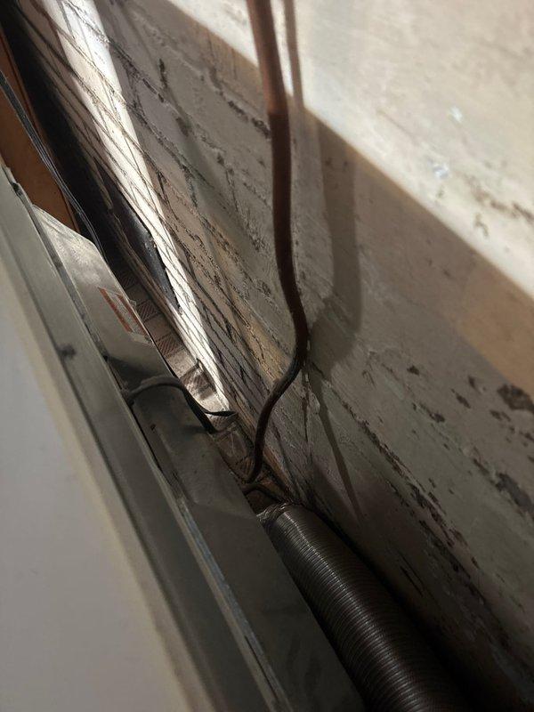 Conducted on-site assessment for basement gas line repiping project. Documented existing conditions including current copper piping configuration, HVAC ductwork placement, and utility room infrastructure. Evaluated routing options for new gas line installation, examining ceiling joist accessibility, existing pipe support systems, and clearance requirements around water heater and mechanical equipment. Photographed current gas line layout, wall conditions, and structural elements to develop comprehensive project estimate for complete gas line replacement throughout basement space.