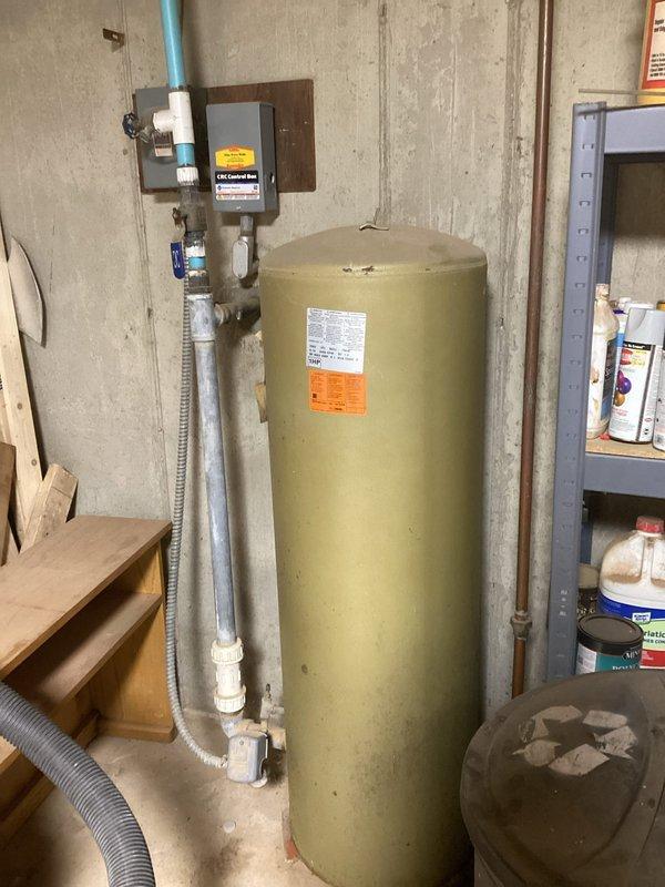 Conducted on-site evaluation of residential plumbing system to assess feasibility and requirements for whole house PFAS filtration system installation. Inspected existing water distribution infrastructure including main supply lines, pressure tank, water heater, and copper piping configuration in basement mechanical space. Documented current system layout, pipe routing, available installation space, and electrical accessibility to determine optimal placement for comprehensive PFAS removal equipment. Photographed existing pressure tank assembly, valve locations, and water heater connections to develop accurate proposal for whole house filtration solution addressing PFAS contamination concerns.