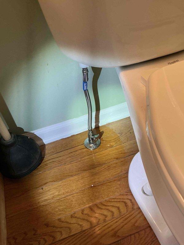 Completed comprehensive plumbing repairs including adjusting kitchen double sink trap connected to garbage disposal pipe and repairing malfunctioning exterior faucet at rear of home. Reset toilet with new wax ring installation and replaced all internal tank components including fill valve, flush valve, and flapper assembly. Inspected and tightened water supply valves, addressing leak at one valve connection to ensure proper seal and prevent future water damage.