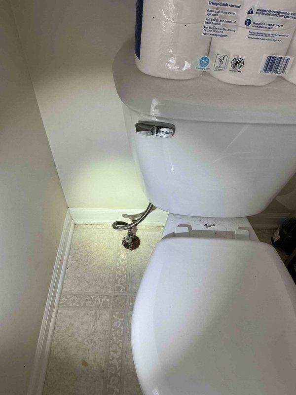 Completed comprehensive plumbing repairs including adjusting kitchen double sink trap connected to garbage disposal pipe and repairing malfunctioning exterior faucet at rear of home. Reset toilet with new wax ring installation and replaced all internal tank components including fill valve, flush valve, and flapper assembly. Inspected and tightened water supply valves, addressing leak at one valve connection to ensure proper seal and prevent future water damage.