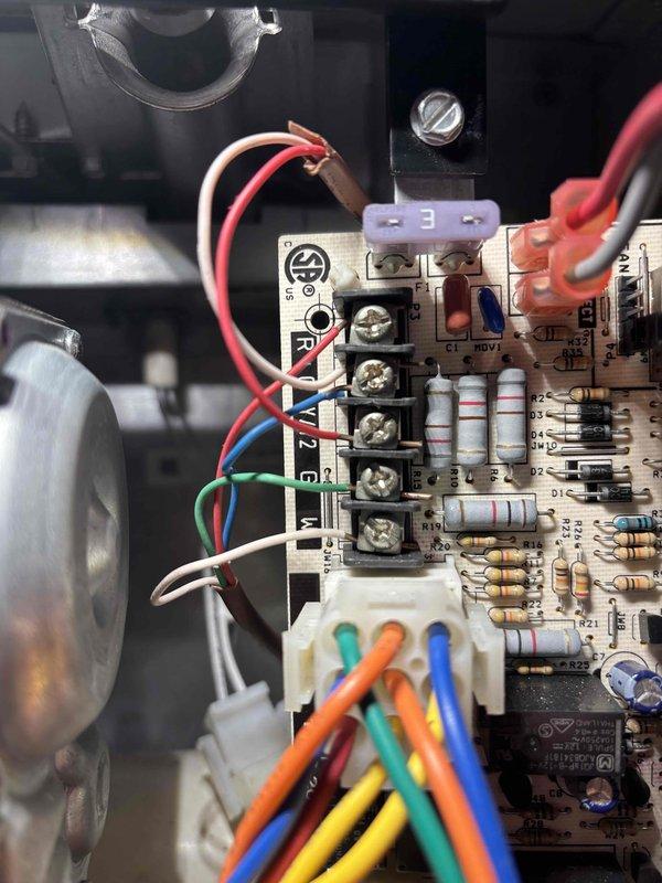Responded to no cooling call on 9-year-old Maytag system with thermostat displaying "lacking Y1 feed" fault. Upon arrival, found both heating and cooling functions inoperative following recent heat exchanger replacement performed by another contractor. Inspected Nest thermostat wiring at wall base and traced connections to furnace control board. Identified missing or improperly terminated Y1 wire connection at control board that was disturbed during previous heat exchanger service. Verified all thermostat wiring terminals including RC, W1, G, C, and Y1 connections. Re-established proper Y1 circuit connection at furnace control board terminal strip, ensuring secure termination. Tested system operation through multiple heating and cooling cycles. Confirmed thermostat fault cleared, air conditioning engaging properly on Y1 call, and furnace responding correctly to heat demand. System restored to full functionality with both heating and cooling operating as designed.