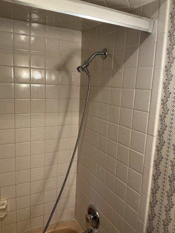 Completed repair of leaking bathroom tub faucet and installed customer-supplied faucet for bathroom sink. Both fixtures are now functioning properly with no leaks detected upon testing and completion of installation.