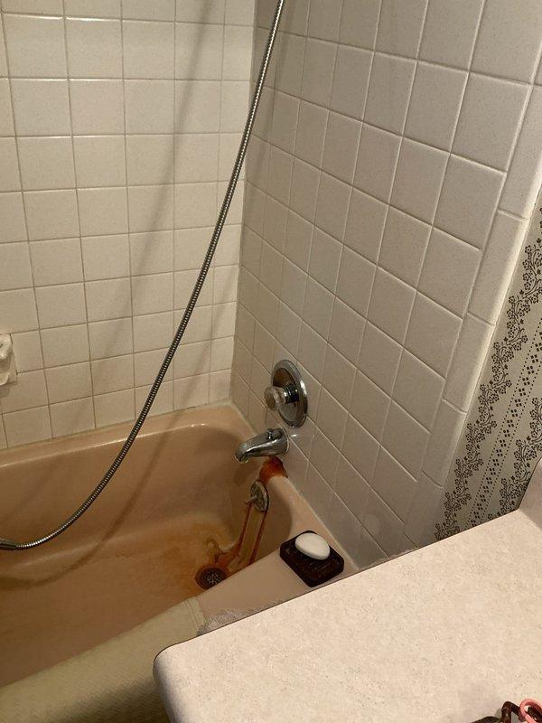 Completed repair of leaking bathroom tub faucet and installed customer-supplied faucet for bathroom sink. Both fixtures are now functioning properly with no leaks detected upon testing and completion of installation.
