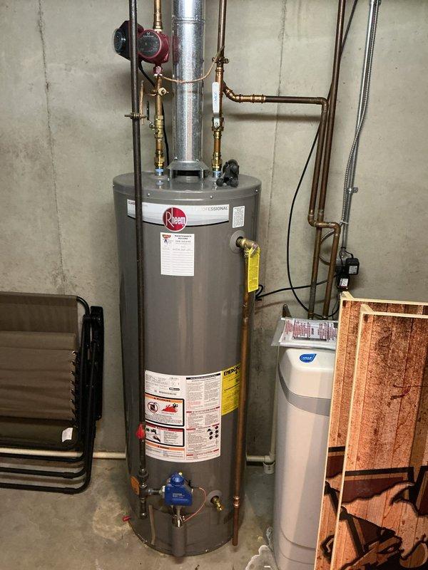 Completed comprehensive AC tune-up on 15-year-old Lennox system located in basement mechanical room. Performed standard maintenance protocol including inspection of furnace and air handler components, verified all manufacturer labels and specifications, checked electrical connections with yellow conduit routing, inspected black flexible ductwork and white PVC drainage piping for proper operation, and documented system condition with photographs. All equipment operating within normal parameters with no immediate service concerns identified.