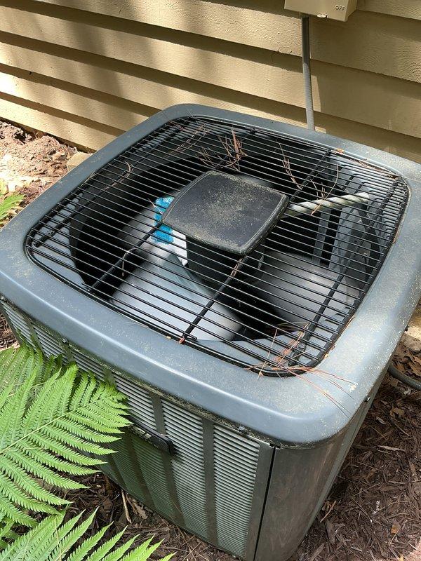 Completed annual cooling maintenance on 12-year-old EnergiAir system with 2019 condenser model. Performed comprehensive tune-up including inspection of outdoor condenser unit, which showed normal weathering and minor debris accumulation on protective grille and surrounding area. Noted significant dust and dirt buildup on interior ventilation grill with concentrated contamination on louvers, indicating need for improved filtration or more frequent filter changes.