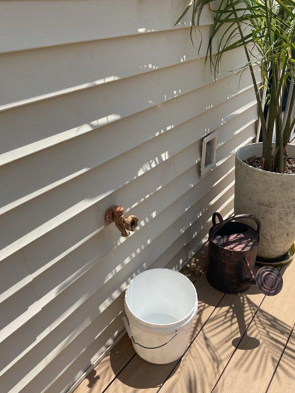 Completed miscellaneous plumbing repairs at residential property during a four-hour service call. Addressed outdoor hose bib installation and related water supply connections on exterior deck area, along with interior plumbing access work involving ceiling cavity components. Work order remains in progress with technician scheduled to return for completion of remaining home repair items.