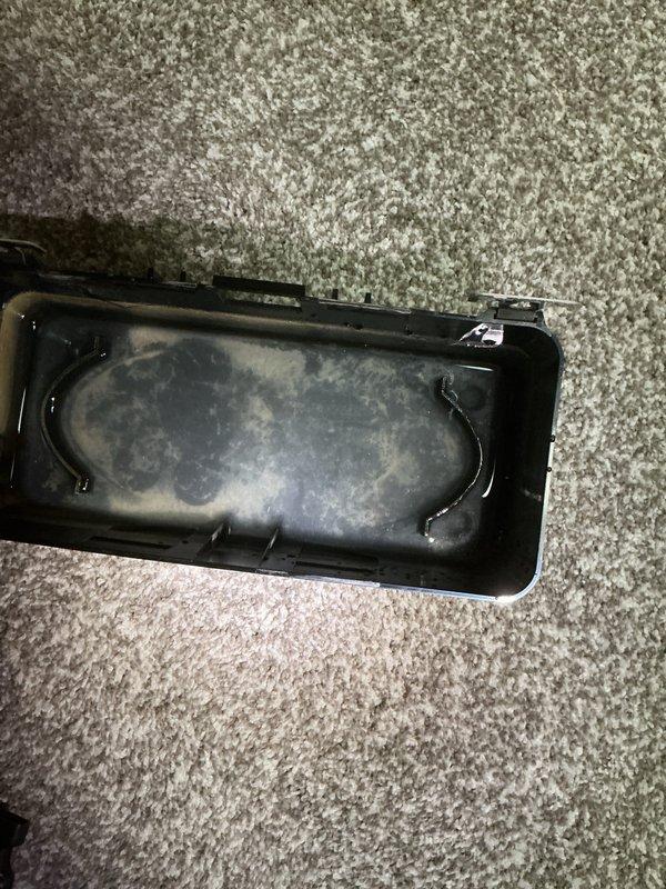 Completed annual cooling maintenance on 1-year-old Carrier system. Discovered standing water with sediment accumulation in condensate drain pan, indicating drainage issue. Cleared condensate line obstruction and verified proper drainage flow to prevent potential water damage and system shutdown.