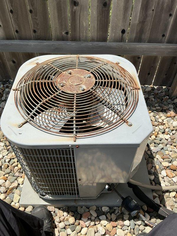 Responded to no-cooling call on 6-year-old Carrier system experiencing startup failure after thermostat delay cycle. Upon arrival, confirmed outdoor condenser unit attempted to start but immediately shut down with no error codes displayed. Inspected outdoor unit and found significant corrosion on fan guard assembly, though unit exterior remained structurally sound. Tested system operation at thermostat and observed 3-4 minute delay mode followed by brief compressor attempt and immediate cutout. Checked electrical connections at outdoor disconnect and indoor furnace junction points—all connections secure with no visible damage to wiring or conduit. Measured voltage supply to condenser unit and confirmed adequate power delivery. Inspected indoor Carrier furnace and associated ductwork for airflow restrictions or safety lockouts that could prevent outdoor unit operation. Evaluated thermostat operation given previous history of thermostat issues reported by homeowner. Determined system saf