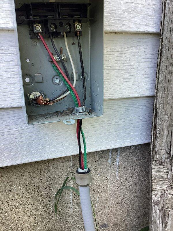 # CP-Cooling Problem Resolution

Responded to service call for Lennox air conditioning unit less than 10 years old that was running but not providing adequate cooling. Upon arrival, performed comprehensive system diagnostic to identify root cause of cooling failure. Inspected outdoor condensing unit, refrigerant lines, electrical connections, and control systems. Evaluated electrical service equipment and disconnect box mounted on building exterior. Verified proper power supply to unit and checked for any electrical issues affecting compressor operation. Documented existing conditions of electrical meter box, service wiring, and outdoor equipment installation with photographs for service records. System assessment completed to determine necessary repairs for restoring proper cooling function.
