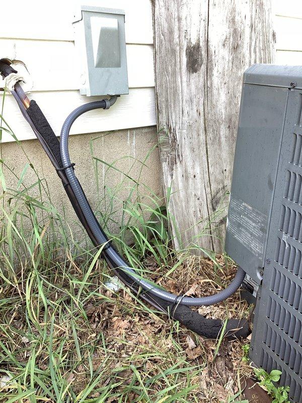 # CP-Cooling Problem Resolution

Responded to service call for Lennox air conditioning unit less than 10 years old that was running but not providing adequate cooling. Upon arrival, performed comprehensive system diagnostic to identify root cause of cooling failure. Inspected outdoor condensing unit, refrigerant lines, electrical connections, and control systems. Evaluated electrical service equipment and disconnect box mounted on building exterior. Verified proper power supply to unit and checked for any electrical issues affecting compressor operation. Documented existing conditions of electrical meter box, service wiring, and outdoor equipment installation with photographs for service records. System assessment completed to determine necessary repairs for restoring proper cooling function.