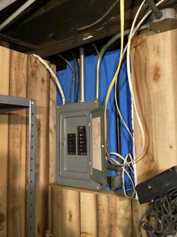 Conducted comprehensive estimate for air conditioning system installation at residential property. Performed thorough evaluation of existing electrical panel located in unfinished basement area, documenting current electrical infrastructure including circuit breaker configuration, incoming service conductors, and available capacity for new AC unit integration. Assessed panel condition, wiring entry points, and determined electrical system's capability to support additional HVAC load requirements for proposed air conditioning equipment installation.