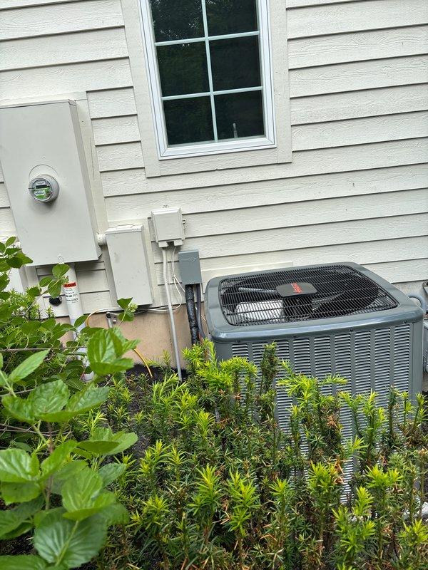 Completed full replacement of two residential air conditioning systems. Removed existing outdoor condensing units and installed new HVAC equipment on concrete pads adjacent to the building exterior. Ran new refrigerant line sets with proper copper tubing connections between indoor and outdoor components. Installed electrical disconnects and connected power supply from existing utility meter to new equipment per code requirements. Verified all refrigerant lines were properly insulated, sealed, and secured. Tested system startup, confirmed proper airflow through ventilation components, and validated all electrical connections were functioning correctly. Both units operational and cooling efficiently upon completion.
