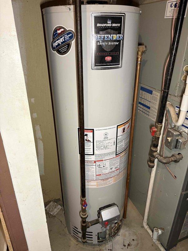Responded to no-ignition condition on 15-year-old Bradford White Defender Safety System water heater. Upon inspection, diagnosed failed ignition system components and determined unit had reached end of serviceable life based on age and condition. Advised customer of repair versus replacement options given the advanced age of the equipment.