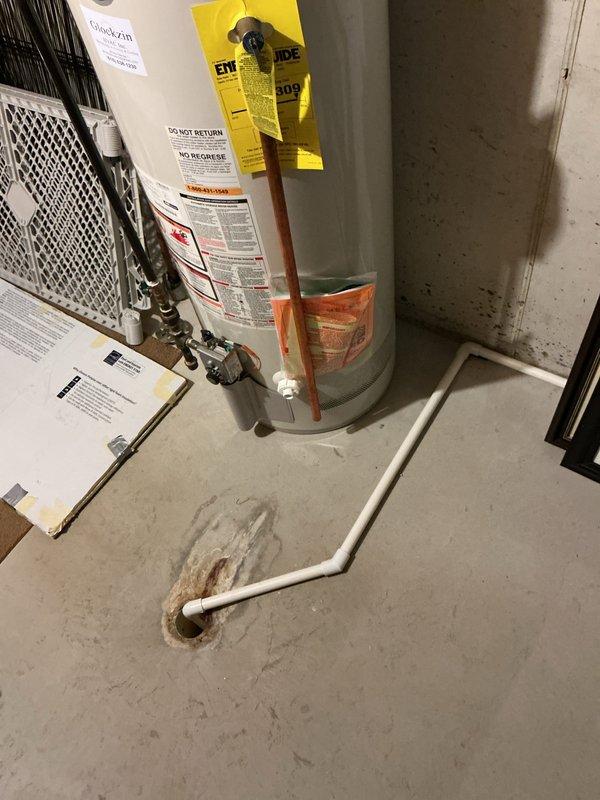 Responded to service call for 13-year-old tank-style water heater producing unusual noises while still providing hot water. Performed comprehensive inspection of unit, examining all plumbing connections, pressure relief valve, and heating elements. Assessed condition of copper supply lines, shut-off valves, and venting system. Evaluated sediment buildup as likely cause of noise based on unit age and operational symptoms. Documented current state of water heater with photographs showing all connections, labels, and surrounding utility space. Confirmed unit is functioning and producing hot water but recommended monitoring given age of equipment approaching typical service life expectancy. Provided assessment findings to customer regarding replacement considerations.