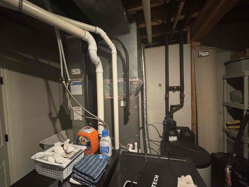 Responded to cooling complaint regarding system not maintaining thermostat setpoint on 9-year-old Lennox air conditioning unit. Performed diagnostic inspection of HVAC system in basement utility area. Utilized borescope camera equipment to conduct internal inspection of ductwork and system components to identify potential airflow restrictions or mechanical issues. Documented equipment conditions and system configuration including condensate drainage lines, mechanical connections, and air handler assembly. Investigation revealed need for further assessment of system performance and capacity relative to cooling load demands.