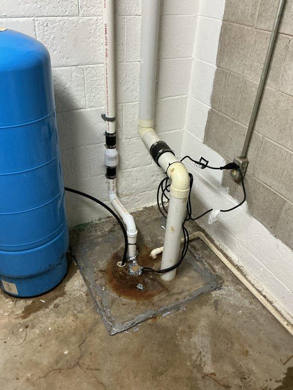 Completed QUOTR-quoted repair addressing spigot and sump pump system issues in basement utility area. Serviced sump pump installation including PVC discharge piping, verified proper operation of pump mechanism within basin, and ensured adequate water management system functionality. Inspected pressure tank, electrical connections, and associated plumbing components to confirm system integrity and proper drainage operation.