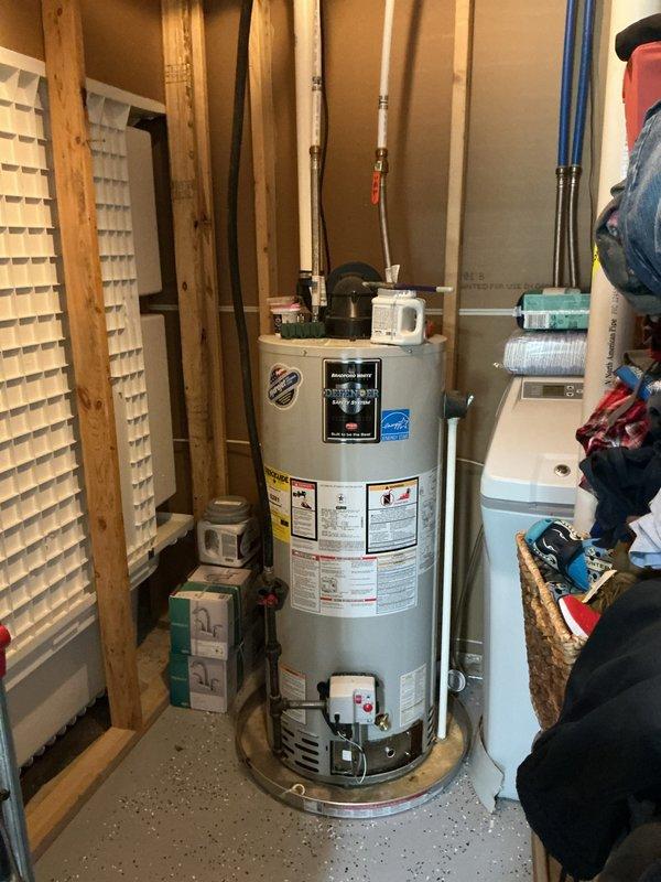 Responded to emergency gas leak concern at water heater location. Upon arrival, customer had already shut off gas supply as a precautionary measure. Conducted thorough inspection of water heater connections, gas supply lines, and surrounding piping using leak detection methods. Inspected copper piping, pressure relief valve, and all gas connections at the unit. Also evaluated electrical panel connections to the water heater per customer's reported concerns regarding electrical issues. Performed visual assessment of all plumbing connections including PEX supply lines with brass fittings and flexible braided hoses. Documented equipment condition and installation with photographic evidence showing 4-year-old water heater unit with all manufacturer labels intact, proper venting configuration, and surrounding utility equipment including water treatment system. Verified all safety systems and connections were secure and properly installed per manufacturer specifications.
