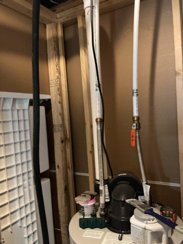 Responded to emergency gas leak concern at water heater location. Upon arrival, customer had already shut off gas supply as a precautionary measure. Conducted thorough inspection of water heater connections, gas supply lines, and surrounding piping using leak detection methods. Inspected copper piping, pressure relief valve, and all gas connections at the unit. Also evaluated electrical panel connections to the water heater per customer's reported concerns regarding electrical issues. Performed visual assessment of all plumbing connections including PEX supply lines with brass fittings and flexible braided hoses. Documented equipment condition and installation with photographic evidence showing 4-year-old water heater unit with all manufacturer labels intact, proper venting configuration, and surrounding utility equipment including water treatment system. Verified all safety systems and connections were secure and properly installed per manufacturer specifications.