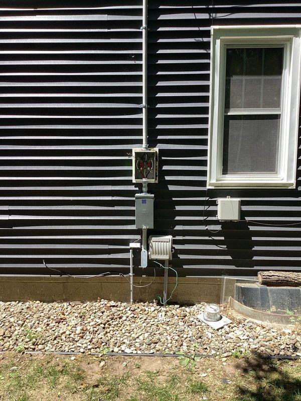 Completed 100-amp electrical service upgrade at residential property. Coordinated utility company power disconnect and reconnect, obtained electrical permit, and installed new exterior meter base with associated conduit work on building exterior. Upgraded interior main electrical panel with new circuit breaker distribution system, completed all wiring connections, and passed municipal electrical inspection. Power was successfully restored following inspector approval.
