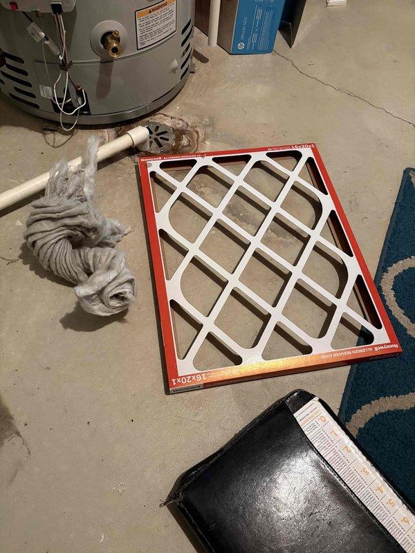 Responded to service call for 13-year-old Heil air conditioning unit reported to be making unusual noises and not producing cold air. Upon arrival, performed comprehensive system inspection of outdoor condensing unit and indoor air handler components. Exterior unit showed signs of age and weathering with accumulated debris on protective grille panels. Inspected indoor equipment and identified severely restricted airflow due to dirty air filter. Replaced existing clogged filter with new filter to restore proper system airflow and operation. Verified system returned to normal cooling operation with reduced noise levels after filter replacement. Advised proper filter maintenance schedule to prevent future issues.