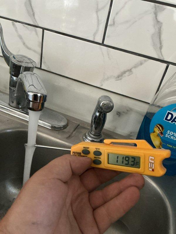 Responded to service call for 2017 Bradford water heater with inadequate hot water temperature despite pilot light functioning properly. Upon inspection, measured outlet temperatures at multiple fixtures throughout the residence. Kitchen sink registered 119°F and utility sink measured 121°F, both significantly below the recommended 120-140°F range for optimal domestic hot water usage. Verified pilot light operation and burner ignition. Adjusted temperature control setting on gas valve to increase water temperature output. Tested system operation through multiple heating cycles to ensure proper burner response and temperature recovery. Educated customer on proper temperature settings and monitoring procedures for future reference.
