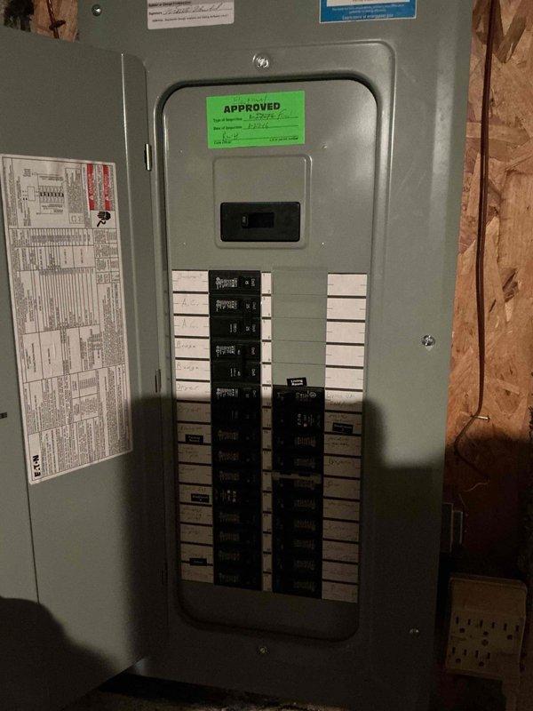 Completed comprehensive electrical club inspection of residential service installation. Evaluated exterior meter base, disconnect switch, and associated conduit connections mounted on building exterior, confirming proper installation and secure mounting of all components. Inspected main electrical panel interior, verified circuit breaker arrangement and labeling, and documented approved installation status with photographic evidence for compliance records.