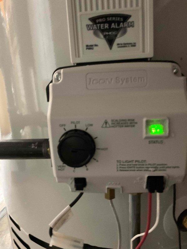 Completed expansion tank replacement on residential water heater system. Installed new blue expansion tank with proper copper piping connections to existing water heater assembly, ensuring correct pressure relief valve integration and secure mounting. Verified Treon System control unit operation with green status indicator illuminated and confirmed water alarm system functionality upon completion.