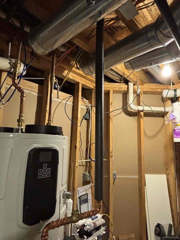 Responded to intermittent hot water outage concerns on a 1-year-old Bradford White water heater. Inspected unit operation, verified proper function of all components, and confirmed adequate hot water production. Temperature setting was adjusted upward by 10 degrees per customer request to address availability issues. Unit operating within normal parameters at time of inspection with no immediate deficiencies noted.