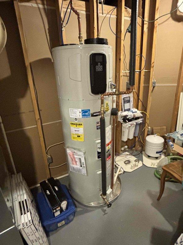 Responded to intermittent hot water outage concerns on a 1-year-old Bradford White water heater. Inspected unit operation, verified proper function of all components, and confirmed adequate hot water production. Temperature setting was adjusted upward by 10 degrees per customer request to address availability issues. Unit operating within normal parameters at time of inspection with no immediate deficiencies noted.