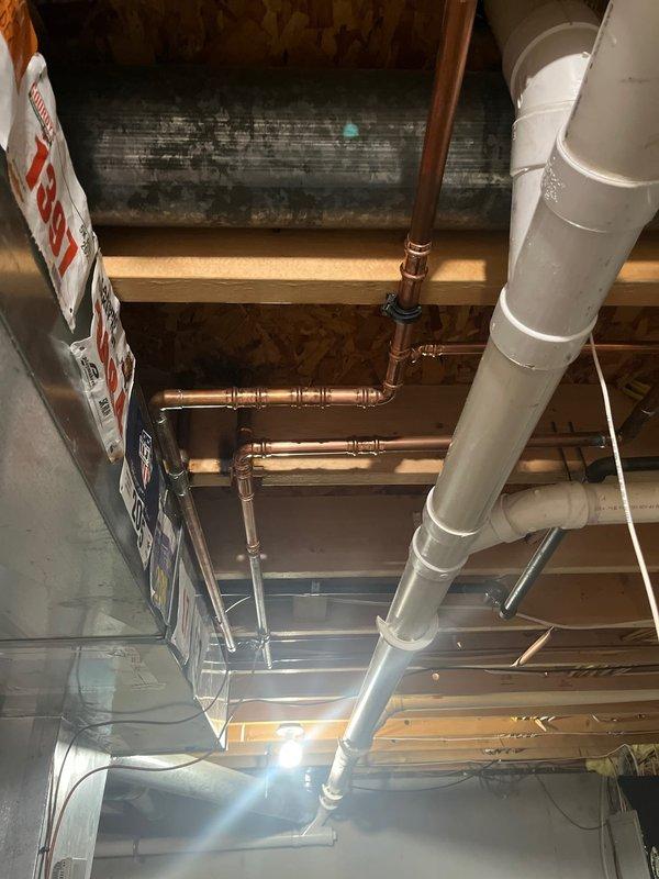 Completed copper waterline repairs by rebuilding the water supply line from the main shutoff valve. Installed new copper piping with proper fittings and elbows, integrated a new shutoff valve and flow meter for system monitoring and control. All connections were properly secured and tested to ensure leak-free operation.