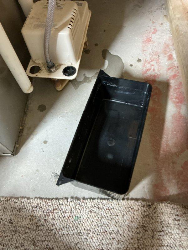 Completed annual cooling maintenance on 2011 Carrier air conditioning system. Inspected evaporator coil and found significant condensation and frost buildup indicating potential airflow restriction or refrigerant issues. Verified condensate pump operation and drain pan placement in mechanical room, noting floor staining from previous moisture issues. All accessible components inspected and system operational at time of departure.