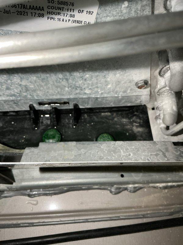 Completed annual cooling maintenance on 2011 Carrier air conditioning system. Inspected evaporator coil and found significant condensation and frost buildup indicating potential airflow restriction or refrigerant issues. Verified condensate pump operation and drain pan placement in mechanical room, noting floor staining from previous moisture issues. All accessible components inspected and system operational at time of departure.
