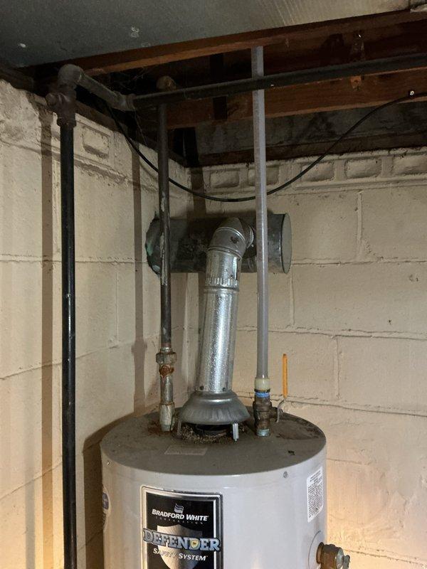 Responded to service call for 10-year-old Bradford White Defender water heater displaying error code of four flashes followed by five flashes, indicating a sensor fault with no hot water production. Upon inspection, diagnosed faulty temperature sensor causing system shutdown. Completed necessary repairs to restore hot water functionality to the unit.
