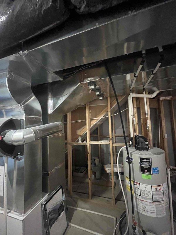 Completed comprehensive AC super tune-up on residential HVAC system with 3-year Carrier warranty coverage. Performed full system inspection of basement-mounted air handler and ductwork, including evaluation of helical duct transitions and plenum connections. Documented Honeywell motorized zone valve actuator installation and verified proper operation of zone control system settings.