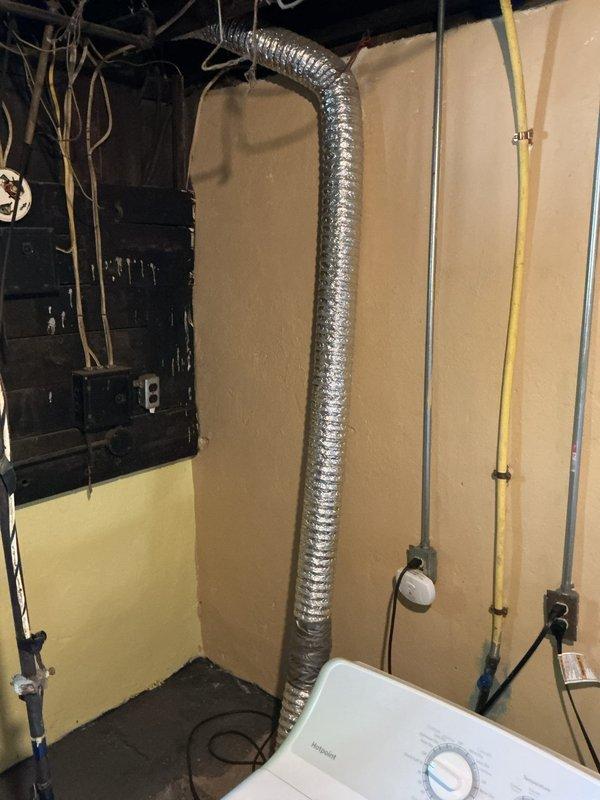 Completed rental inspection of basement mechanical room. Inspected and documented one water heater as requested (furnace excluded from inspection as unit is new). Photographed water heater installation, surrounding HVAC equipment including Carrier furnace, plumbing connections, exposed ductwork, and overall mechanical room conditions for rental property documentation purposes.