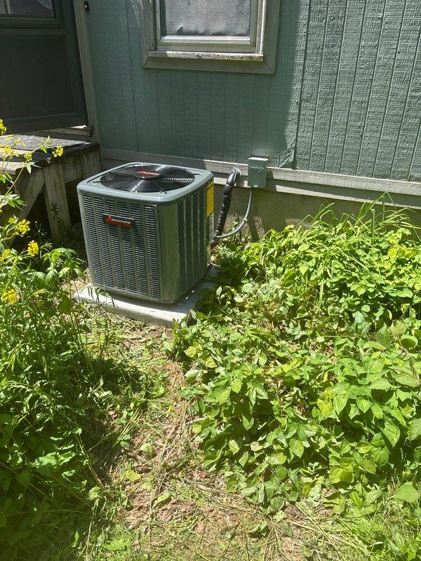 Completed full HVAC system installation including new furnace, air conditioning unit, and water heater at residential property. Installed Trane condenser unit on exterior concrete pad with proper refrigerant line routing and insulation penetrating building envelope. Installed Bradford White water heater in basement utility area with copper supply piping, pressure relief valve assembly, and all code-required safety components and labeling.